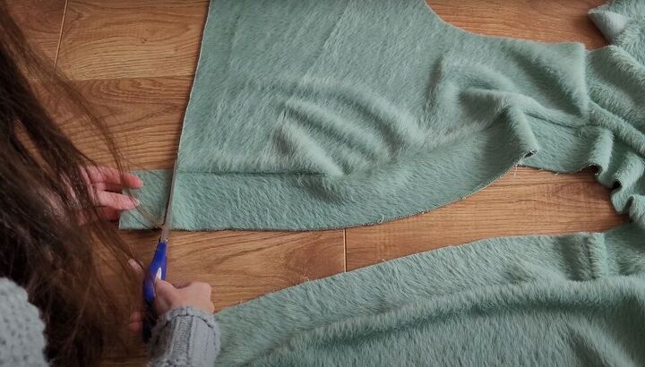 how to make a cozy diy wrap cardigan out of soft eyelash fabric, Trimming the excess binding