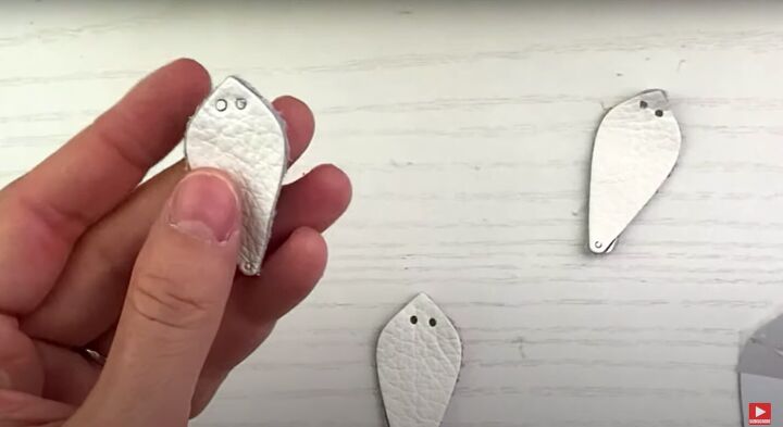 how to make cute diy pinched leather earrings, Using a hole cutter on the smallest setting