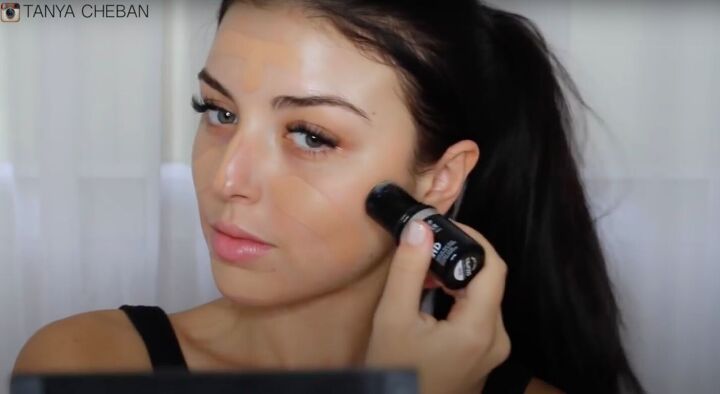 simple contouring highlighting baking routine for a natural glam, Applying stick foundation to the face