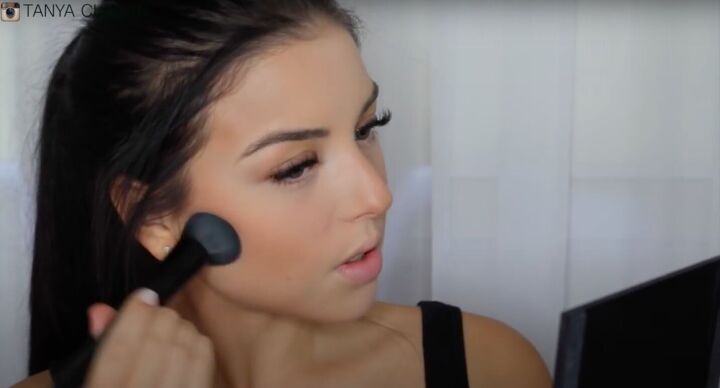 simple contouring highlighting baking routine for a natural glam, Blending makeup with a clean makeup brush
