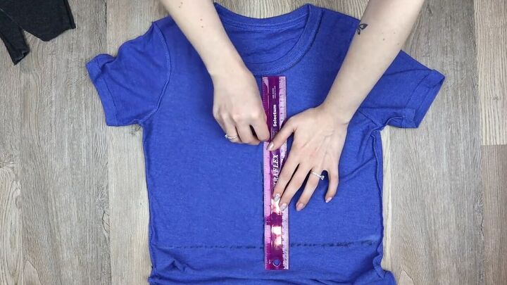 5 ways to make a diy crop top from a t shirt easy no sew tutorial, Drawing a line down the t shirt