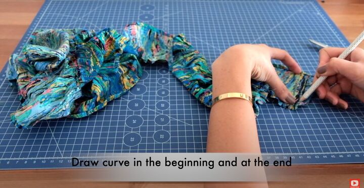 how to make a ruffle wrap skirt matching crop top from a maxi dress, Drawing a curve at the end of the ruffle