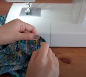how to make a ruffle wrap skirt matching crop top from a maxi dress, Hand sewing a button onto the skirt