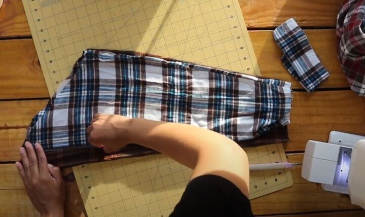 how to make a flannel shirt dress out of 4 old men s shirts, Tracing the sleeve pattern as a size guide
