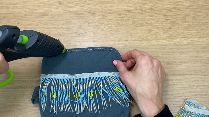 how to make a no sew diy crossbody bag out of dollar tree potholders, Gluing the beaded fringe