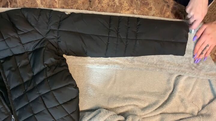 how to make a puffer jacket out of a plush walmart blanket, Tracing the sleeves for the pattern