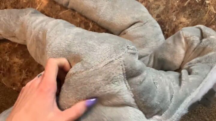 how to make a puffer jacket out of a plush walmart blanket, Feeding the lining through the sleeves