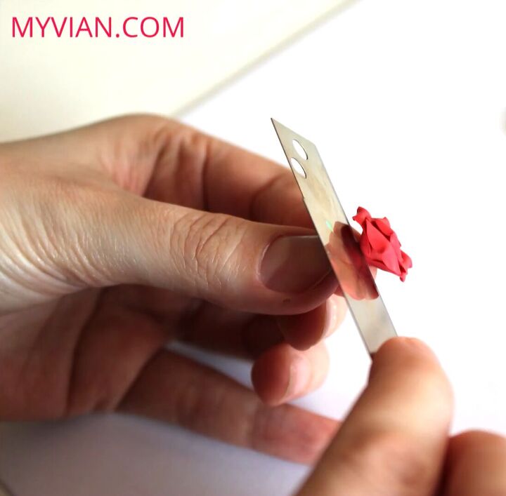how to make dainty romantic diy polymer clay rose earrings, Cutting off the stem of the rose