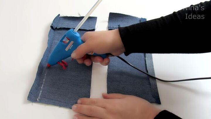 how to make a cute diy wrist wallet out of old jeans, Gluing the the folds down