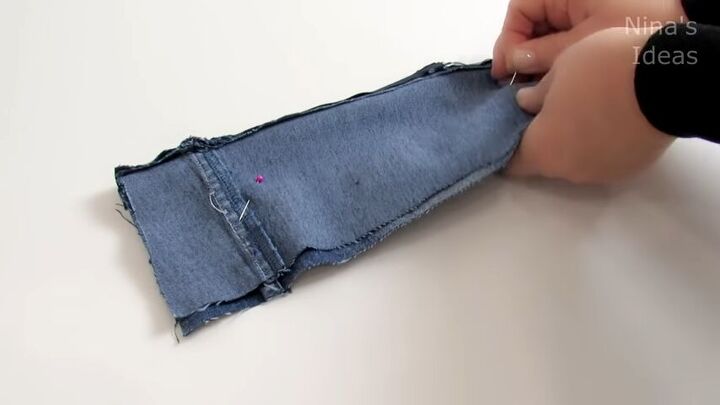 how to make a cute diy wrist wallet out of old jeans, Flipping the fabric