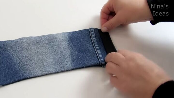 how to make a cute diy wrist wallet out of old jeans, Gluing the Velcro to the wrist wallet