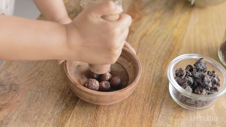5 natural ways to wash hair without shampoo, Crushing the soapnuts with a pestel
