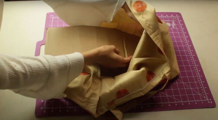 how to sew a tote bag in 3 different ways, Inserting cardboard into the bottom of the bag