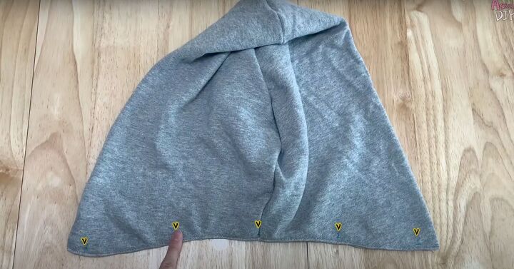 add a hood to any jacket with this simple detachable hood diy, Using the marks to places the buttons