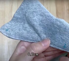 add a hood to any jacket with this simple detachable hood diy, Measuring the holes for the buttons