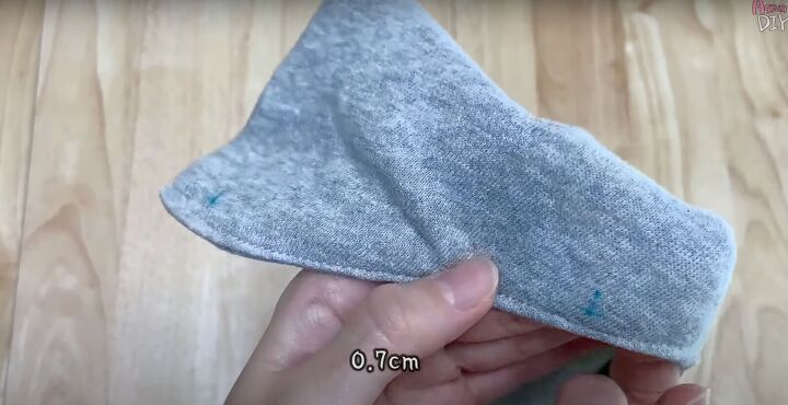 add a hood to any jacket with this simple detachable hood diy, Measuring the holes for the buttons