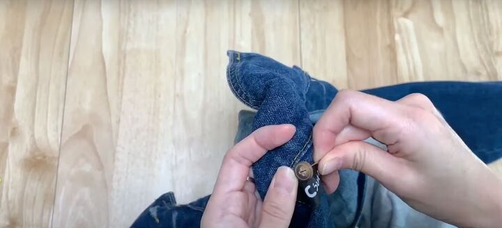 add a hood to any jacket with this simple detachable hood diy, Sewing buttons onto the jacket