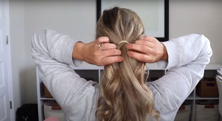 4 quick easy cute 1 minute hairstyles for when you re in a rush, Tying hair into a low ponytail