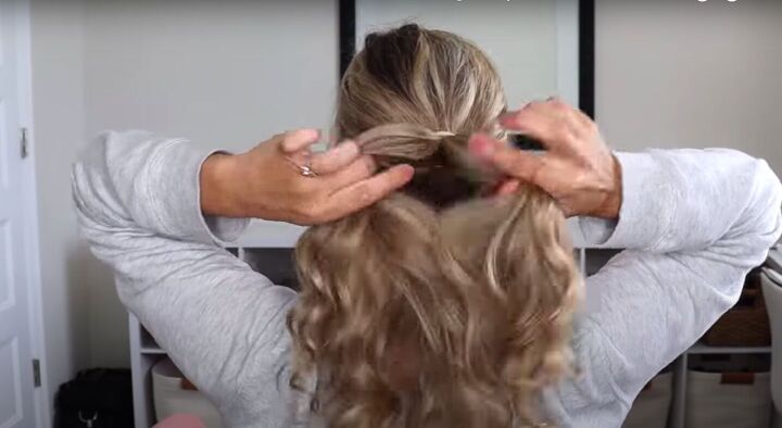4 quick easy cute 1 minute hairstyles for when you re in a rush, Dividing the low ponytail into two sections