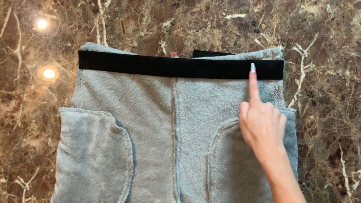 how to make cozy fleecy joggers out of a large fuzzy blanket, Attaching the waistband to the joggers