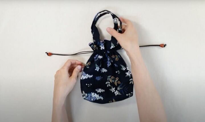 how to make a cute diy drawstring tote bag free pattern in 2 sizes, Pulling on the drawstring cords
