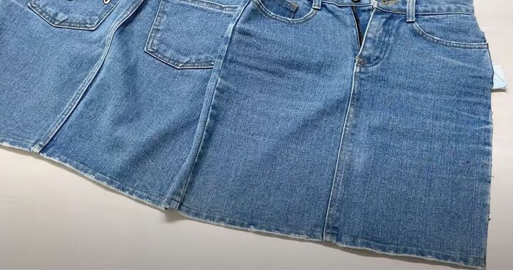 how to make a quick simple diy denim tote bag out of a jean skirt, Cutting open the denim skirt