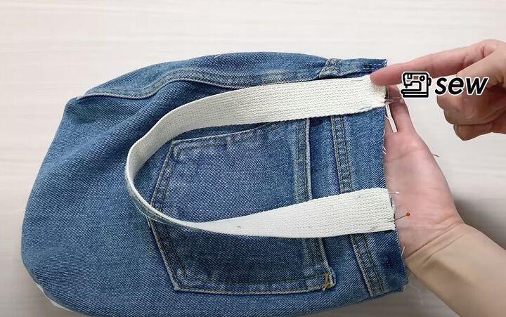 how to make a quick simple diy denim tote bag out of a jean skirt, Pinning the straps to the bag
