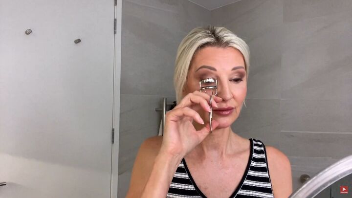 do you have droopy or hooded eyes try this eye lift makeup trick, Using eyelash curlers