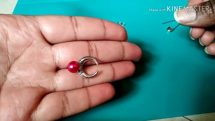 how to make stud earrings unique by adding chains charms more, Placing a charm on the earring