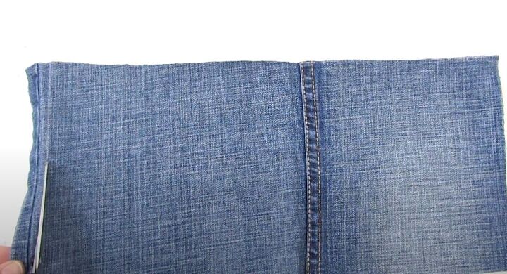 how to make a crossbody bag out of jeans without sewing, Cutting off the inside seam