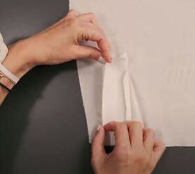 how to easily sew a sleeve placket and cuff in a few simple steps, Folding the long edges of the placket ready to press