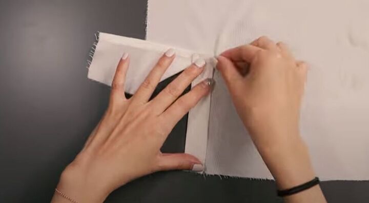 how to easily sew a sleeve placket and cuff in a few simple steps, Folding the placket in half to cover the stitch line