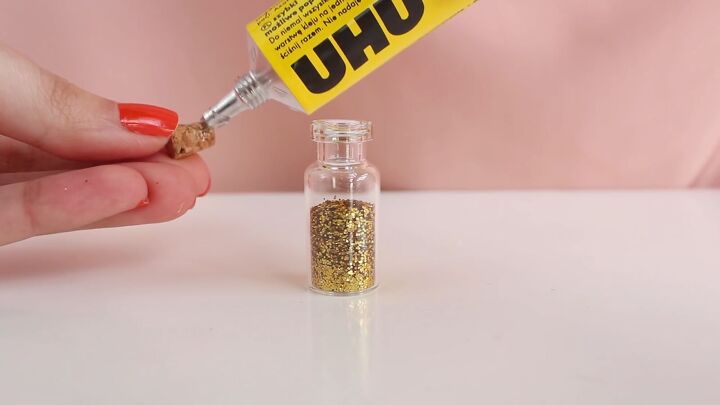 how to easily make diy jar necklaces filled with glitter salt more, Gluing the cork to seal the bottle