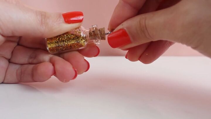 how to easily make diy jar necklaces filled with glitter salt more, Adding an eye hook into the cork