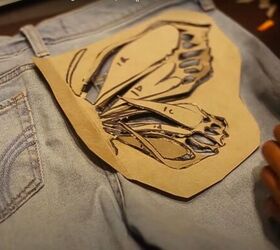 how to create a beautiful butterfly bleach design on jeans, Positioning the butterfly stencil on the jeans