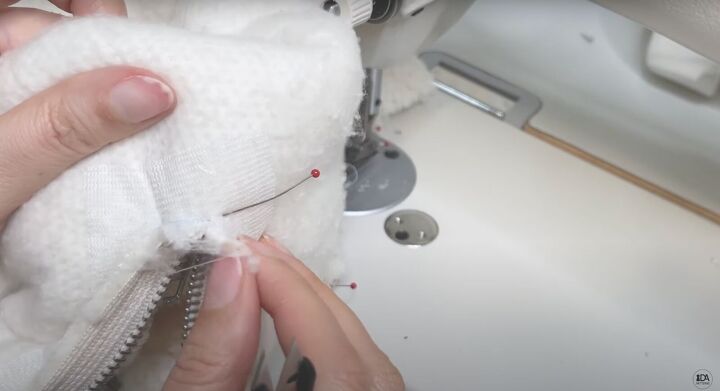 how to sew a sweater with a cute cropped hem half zipper, Cutting the corners of the zipper frame