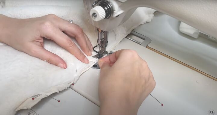 how to sew a sweater with a cute cropped hem half zipper, Sewing the zipper tape