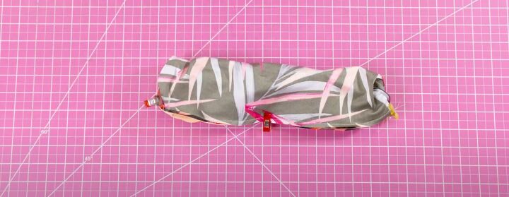 how to make your own high waisted bikini bottoms with a seamless waist, Clipping the waistband in place ready to sew