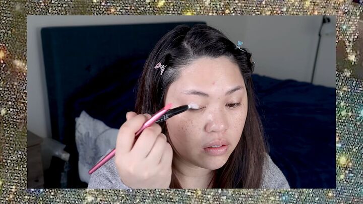 put a spin on 90s makeup with this fun 1990s inspired makeup tutorial, Applying primer to eyelids