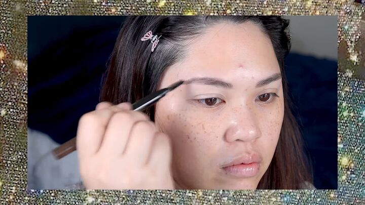 put a spin on 90s makeup with this fun 1990s inspired makeup tutorial, Filling in brows with an eyebrow pen