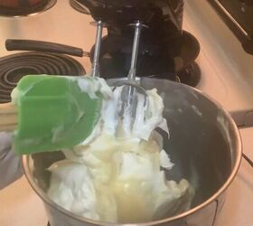 how to make an all natural soothing diy body butter for eczema, Stirring the DIY body butter with a spatula