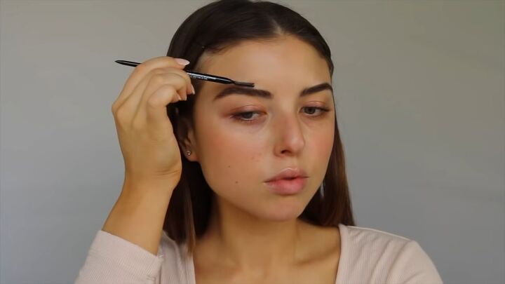 how to create a sweet soft glowy spring makeup look, Filling in brows and feathering them with a spoolie