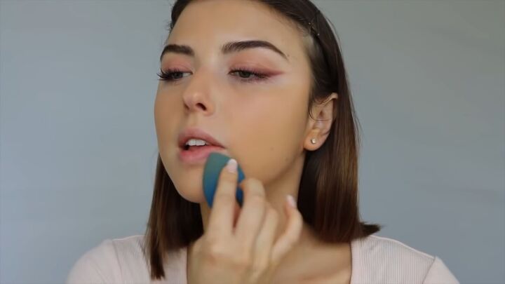how to create a sweet soft glowy spring makeup look, Blending foundation with a makeup sponge