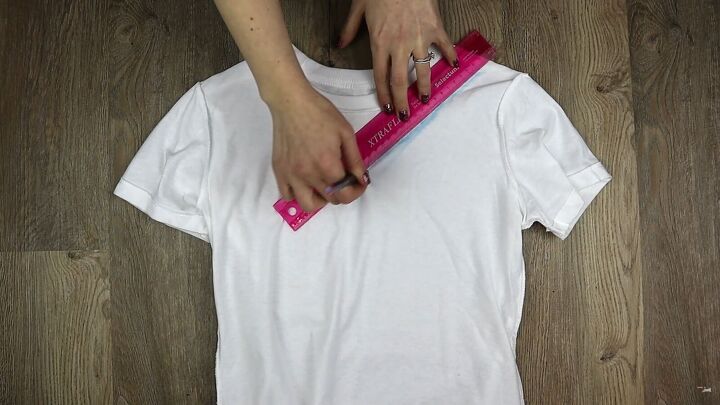 3 cool t shirt cutting ideas that are completely no sew, Using a ruler to mark the slash