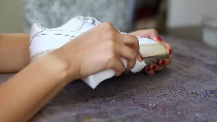 how to make sneakers white again making old yellow sneakers look new, Using a magic eraser sponge to clean the sneakers