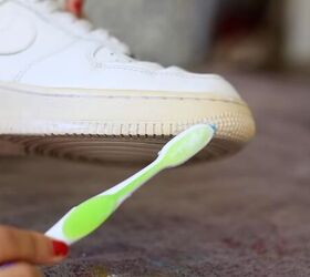 how to make sneakers white again making old yellow sneakers look new, Applying Sole Bright with a toothbrush