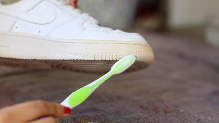 how to make sneakers white again making old yellow sneakers look new, Applying Sole Bright with a toothbrush