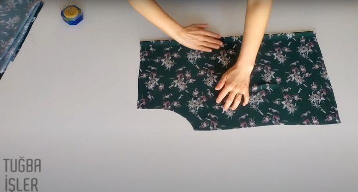 how to make a flattering diy blouse from scratch in 4 simple steps, Folding one of the pattern panels in half