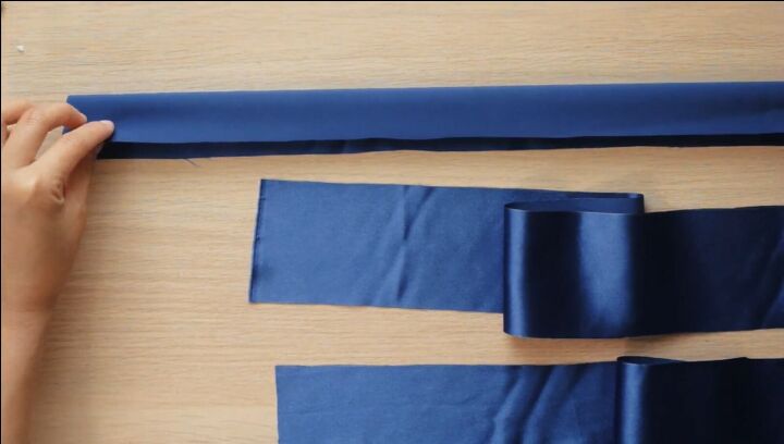 how to make a braided headband out of silk fabric ribbon, Folding the strip of blue silk ready to sew