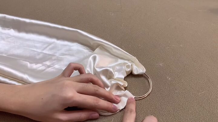 how to make an easy diy o ring top you can wear 6 different ways, Inserting the O rings into the tunnel